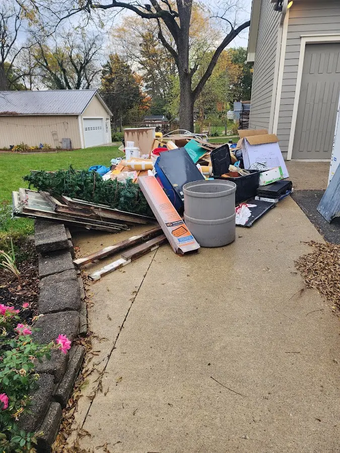 Dumpster being loaded with debris for Roofing Dumpster Rental in Arroyo Grande